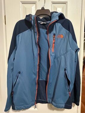 The North Face Women’s Blue Hooded Softshell Jacket with Orange Zippers
